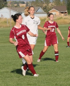 Hamilton’s Erin Loranger (6) and Casey Shifflett (12) battle Stevensville’s Brooke Constantino in the inter valley match at Stevensville. Jean Schurman photo