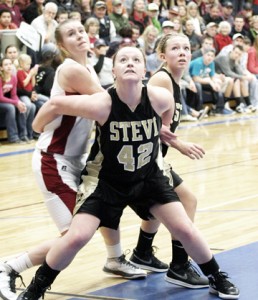 Kayla Peterson of Stevensville blocks Taylor Goligoski of Hamilton out of the key with Bailey Vercruyssen helping Peterson. Jean Schurman photo