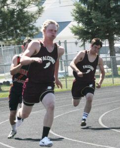 Carter Brady makes the turn in the 200 time trials with teammate Brady Heffner not far behind. Jean Schurman photo