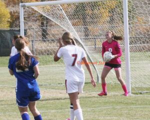 Hamiton’s keeper, Taylor Goligoski, makes a save during the Broncs’ first round playoff game against Columbia Falls. Jean Schurman photo