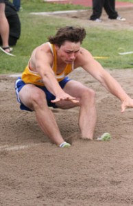 Zac Agee of Victor finished first in the long jump with this leap of 20’10”. Jean Schurman photo