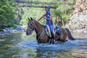 Edman of Florence crosses one of the many rivers on the Tevis Cup Endurance Race that was held a couple of weeks ago.  submitted photo