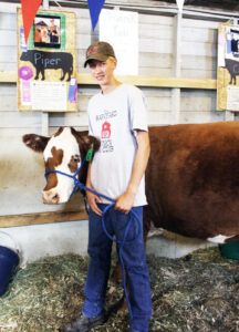 Brody Severson of the Barnyard Bunch 4H Club had the high selling steer at the Ravalli County Fair. His grand champion steer, a Maine Anjou/Hereford/Angus cross, weighed in at 1,360 pounds and sold for $6.50 a pound for a total of $8840. The steer came from his family’s ranch, Severson’s Flying E Ranch east of Stevensville, and was purchased by the Barkus Ranch of Corvallis. Jean Schurman photo.