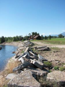 The Bitterroot Conservation District has given the landowners of this property until the next high water event to clear this concrete rubble away from the river bank and the remove the material that has already fallen into the river.