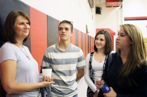 Jeannie Smith, daughter of Irene Gut Opdyke, a Holocaust survivor and rescuer, visits with Darby students Rope Rennaker, Tori Johnston, and Lacey Dolcater after talking to the student body about her mother’s book and story. Jean Schurman photo.