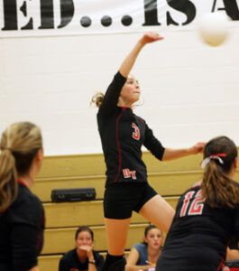 Breanna Brickey makes a kill during the match against Philipsburg. The Lady Tigers won and are in first place in District 9C. Jean Schurman photo