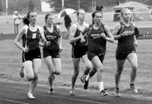 It was an all valley finish in the 1,600 meter race. Shown are Kaitlyn Stromberg of Hamilton, Albany Jessop of Corvallis, Jaycie Schmalz of Hamilton, and Isabella Pape and Amelia Gardner of Corvallis. Schmalz was the eventual winner. Jean Schurman photo.