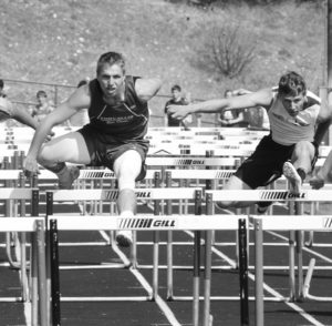 Corvallis’ Taylor Sylvester clears the hurdles in the 110 hurdles. Blake Hempstead photo.