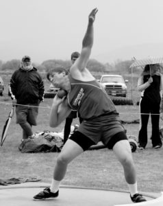 Corvallis’ Jayce Gilder shows his form during the shot put competition at the Southwest A Divisional track meet. Jean Schurman photo.
