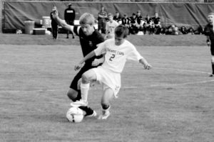 Sam Bosio of Hamilton keeps the ball from a Billings Central player in the Broncs’ match against the Rams. The Broncs’ lost, 4-1. Jean Schurman photo.