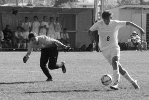 Corvallis’ Emmet Semple gets past the Livingston keeper and sets up for a shot on goal. Corvallis won and will play next week in the semi finals in Billings. Jean Schurman photo