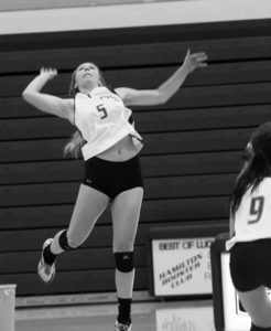 Hamilton’s Shannon Casale goes for a kill during the Columbia Falls match. Jean Schurman photo.