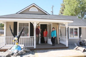 Bitterroot Valley Chamber of Commerce Al Mitchell, board member and building owner Rosie Huckstadt and board president Sherri Williams invite you to come in to the new Visitor Information Center in Darby. Jean Schurman photo.