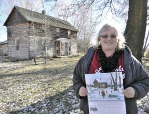 Well-known artist Ella Buckallew, who was born and raised in the Stevensville area, was commissioned to do the artwork for the new calendar commemorating the 175th anniversary of the community that became Stevensville. The calendar features illustrations of historic buildings in the area, including the 1876 log home above, known as the Moses Baker place, and now the family home of Star publishers Michael and Victoria Howell. Michael Howell photo.