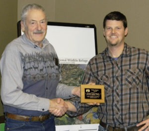 Gavin Ricklefs, Executive Director of the Bitterroot Land Trust (right), presents the Fletcher Newby Award to Paul Hayes, President of the Friends of the Lee Metcalf National Wildlife Refuge. The annual award is given to honor consistent, long-term supporters of the land trust. Michael Howell photo.