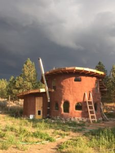 This cob house located near Stevensville cost the owners, Daniel and Katherine Ray, only $4,000 to build. The free standing walls are built out of a mixture of clay, sand and straw prepared by combining it with water and stomping on it until it reaches the desired consistency. 