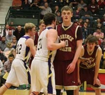 Jefferson County players Trase Letexier (31) and Jered Padmos (12) lean into Florence’s Dan Mickelson and Levi Clagett as they wait for the ball to be in bounded. Jake Christopherson is to the right. Florence topped Jefferson in the first game of the state tournament. Jean Schurman photo. 