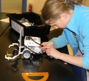 Lone Rock 6th grader Crystal Hazel works on the robot that she designed as part of science teacher Rich Montoya’s Robotics Class. Michael Howell photo.