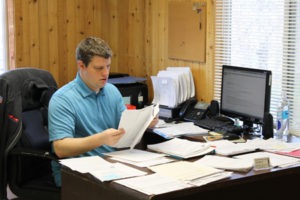 Mike Warner, Veterans’ Services Officer, at his desk in the Valley Veterans Service Center, now located at 217 N. 3rd in Hamilton. Daphne Jackson photo.