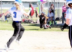 Taia Tully (3) of Corvallis races to home plate as Hamilton’s catcher Jen Meis reaches to catch the ball. Hamilton defeated Corvallis, 15-6. Jean Schurman photo.