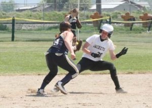 Stevensville’s Haley Kampka gets run down by a Dillon player at first base after getting into a pickle. Jean Schurman photo.