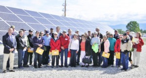 Above: Governor Steve Bullock stands with dozens of solar panel purchasers who were honored for their commitment to clean local energy production. Many of the purchasers are owners and operators of the co-op and REC General Manager Mark Grotbo thanked them for making the investment, “especially when the economics are longer-term but looking into the future of things to come. Without your investment, thought, support and enthusiasm, this wouldn’t have happened,” he said. Michael Howell photo.