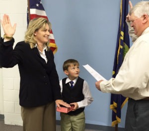 Stevensville Mayor Jim Crews administered the oath of office to new Municipal Court Judge Maureen O’Connor assisted by O’Connor’s son, who held the Bible, at a swearing in ceremony last Friday at the town hall. Michael Howell photo.