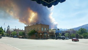 The Roaring Lion Fire roared into view from the second block of downtown Hamilton on Sunday afternoon around 3:40 p.m., gobbling up 2000 acres in less than 12 hours and prompting evacuation of at least 500 homes. More than 3500 acres and at least 14 structures have already burned and continuing hot, dry weather and high winds are cause for concern. Crystal Schurman photo.