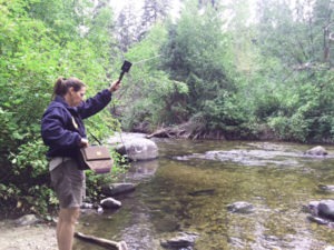 FWP Fisheries Biologist Leslie Nyce uses a radio antennae to search for signals from the transmitters that she embedded in 24 bull trout released in Sleeping Child Creek. As of last week all but one of the fish had moved upstream, some a few miles upstream, from the point at which they were released. Officials hope to learn where the fish are spawning and wintering. Michael Howell photo.