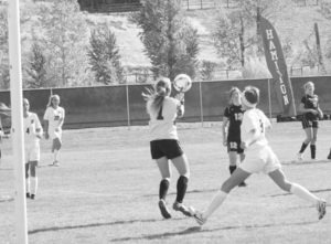 Stevensville keeper Sami Merwin makes a save as Hamilton’s Jamie Moffatt gets in position for a rebound. Jean Schurman photo.