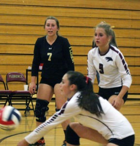 Sisters Hunter (7) and Hudsyn (9) Doty-DiBrito along with Shannon Byrne work hard to keep the ball in play during every Florence volleyball match. Jean Schurman photo.